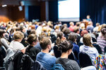 attendees seated in a lecture theatre